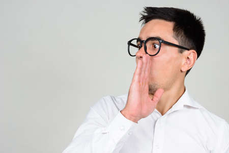 Portrait of handsome businessman against white backgroundの写真素材