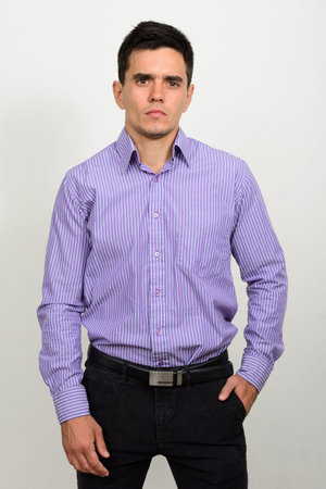 Portrait of handsome businessman against white backgroundの写真素材