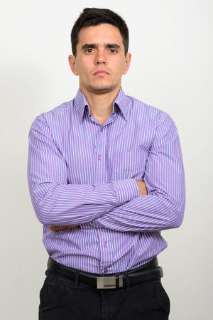 Portrait of handsome businessman against white backgroundの写真素材