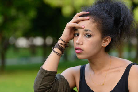 Portrait of young beautiful African woman at the park outdoorsの写真素材