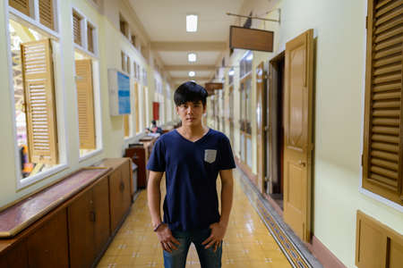 Young handsome Asian tourist man at the railway stationの写真素材