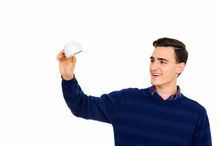 Portrait of happy young handsome man against white background