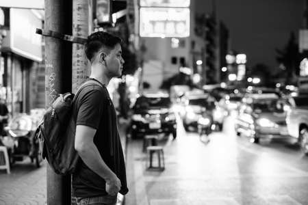 Portrait of young handsome Asian tourist man exploring at Chinatownの写真素材