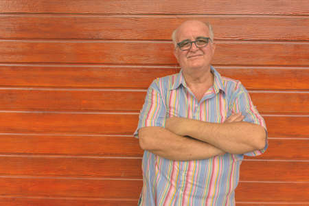 Portrait of overweight senior tourist man exploring around the cityの写真素材