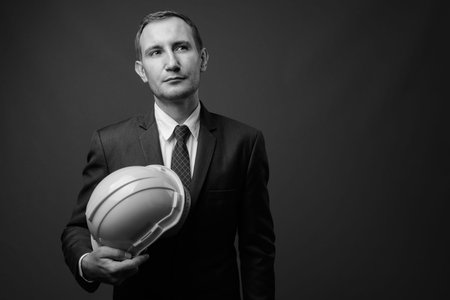 Portrait of businessman as engineer with hardhatの写真素材