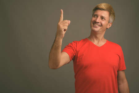 Portrait of happy man with blond hairの写真素材