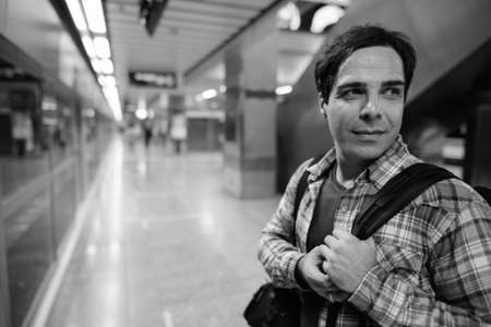 Portrait of handsome Persian tourist man exploring the cityの写真素材