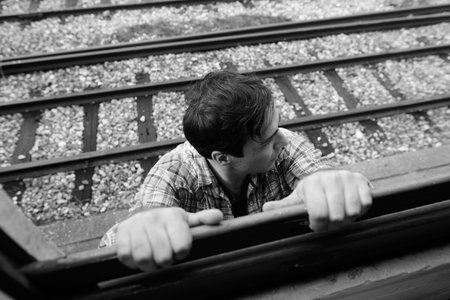 Portrait of handsome Persian tourist man at the railway station
