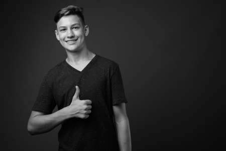 Studio shot of young handsome teenage boyの写真素材