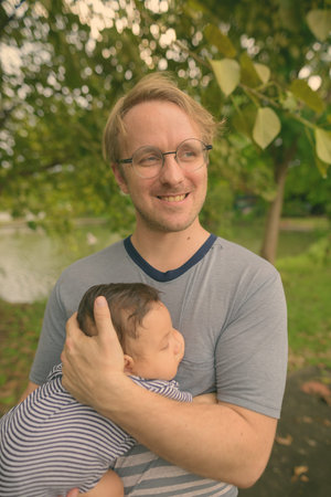 Father and baby son bonding together at the park