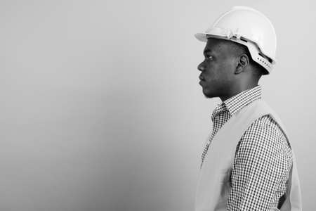 Young African man construction worker against white backgroundの写真素材