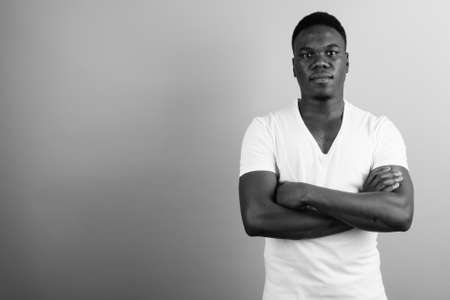 Portrait of young African man against white backgroundの写真素材
