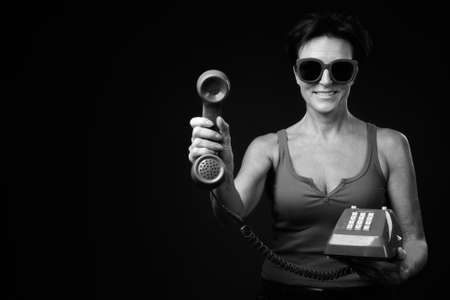 Portrait of happy mature beautiful woman with short hairの写真素材