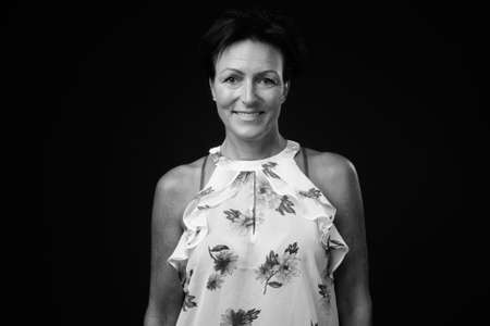 Portrait of happy mature beautiful woman with short hairの写真素材