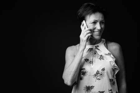 Portrait of happy mature beautiful woman with short hairの写真素材
