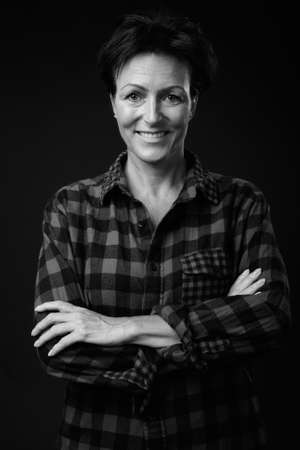 Portrait of happy mature beautiful woman with short hairの写真素材