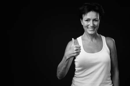 Portrait of happy mature beautiful woman with short hairの写真素材