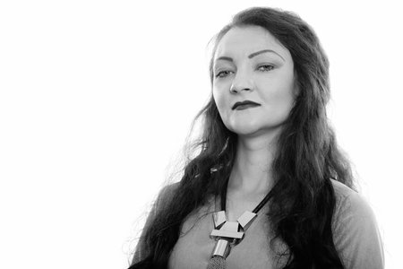 Studio shot of woman looking at camera