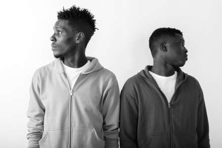 Profile view of two young African men looking at different directionsの写真素材