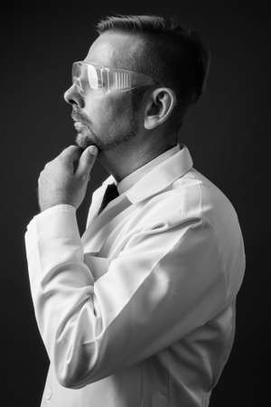 Blond bearded man doctor with goatee against gray backgroundの写真素材