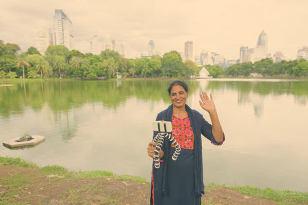 Mature beautiful Indian woman exploring the city of Bangkok, Thailand