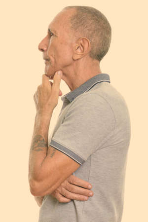 Profile view of senior man thinkingの写真素材