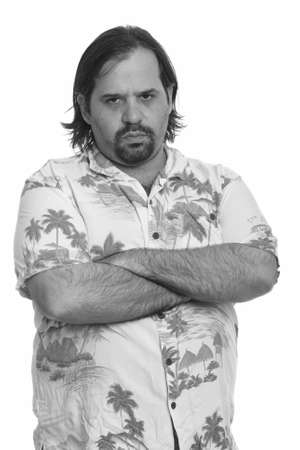 Fat Caucasian man looking angry with arms crossedの写真素材