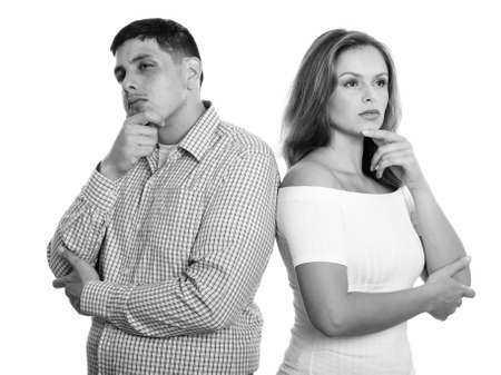 Studio shot of young couple thinking togetherの写真素材