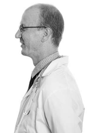 Profile view of happy man doctor smilingの写真素材