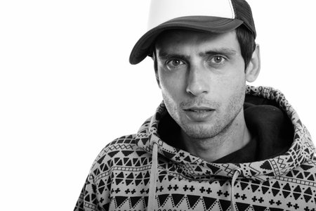 Close up of young handsome man wearing cap