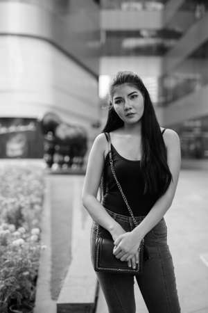 Young beautiful Asian woman exploring around the cityの写真素材