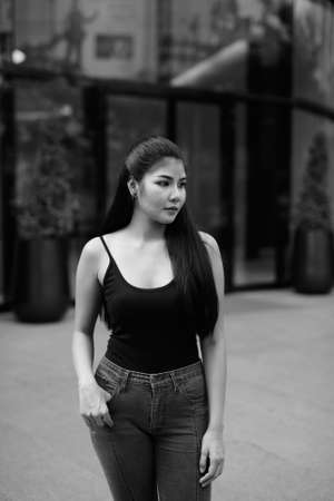 Young beautiful Asian woman exploring around the cityの写真素材