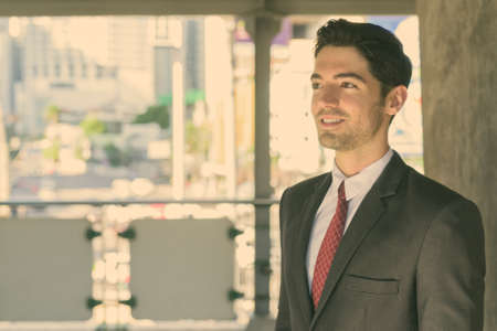 Young handsome businessman exploring the city of Bangkok, Thailandの写真素材