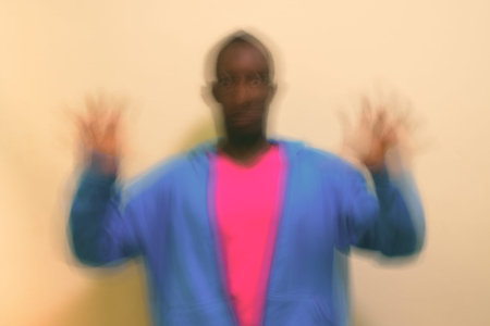 Studio shot of young African man against white background
