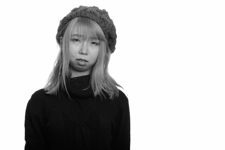 Portrait of young Asian woman with turtleneck sweater