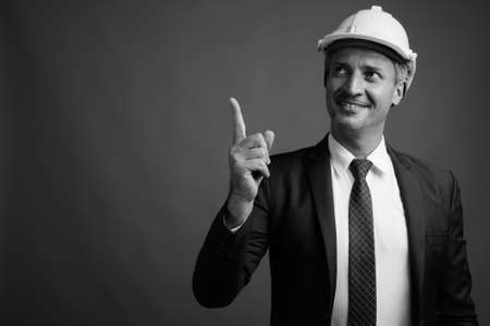 Portrait of businessman as engineer with hardhatの写真素材