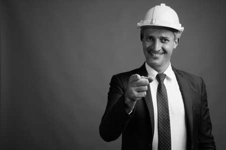 Portrait of businessman as engineer with hardhatの写真素材