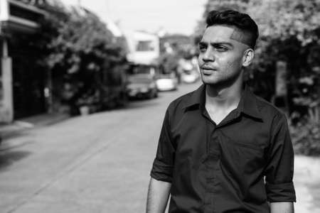 Young Indian businessman in the streets outdoorsの写真素材
