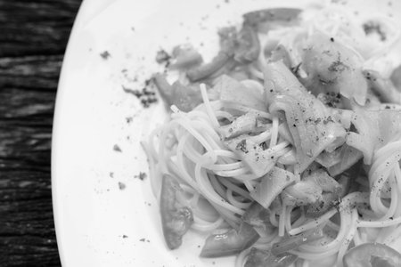 Salmon Spaghetti With Fresh Tomato Against Wooden Table