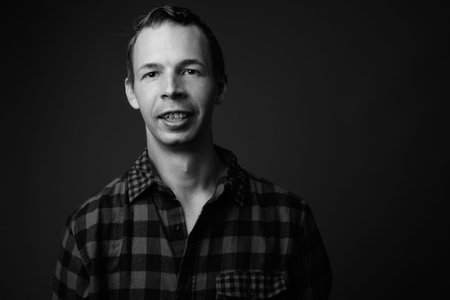 Studio shot of hipster man against gray background