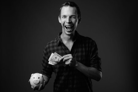 Studio shot of hipster man against gray background