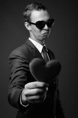 Studio shot of businessman against gray backgroundの写真素材
