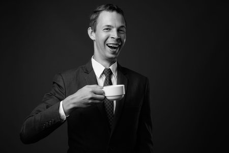 Studio shot of businessman against gray backgroundの写真素材