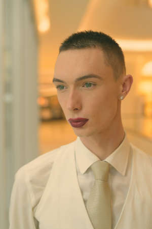 Young handsome androgynous businessman exploring the city of Bangkok, Thailandの写真素材