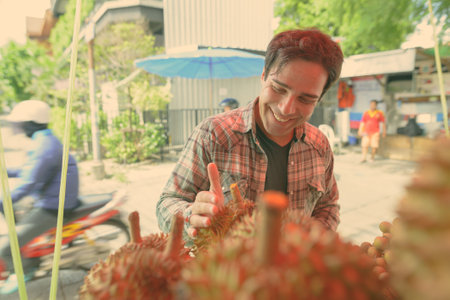 Handsome Persian tourist man exploring the city of Bangkok, Thailandの写真素材