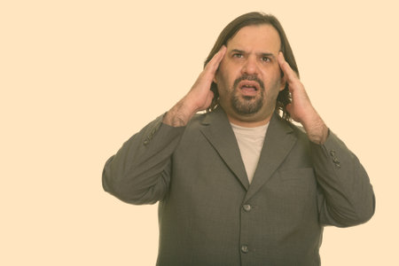 Fat Caucasian businessman having headacheの写真素材