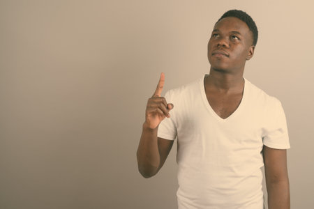 Young African man against white backgroundの写真素材