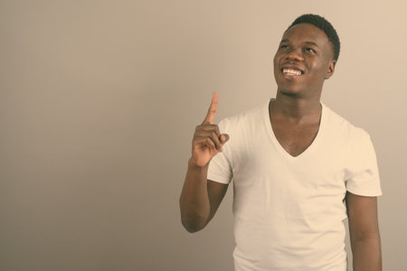 Young African man against white backgroundの写真素材