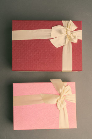 Studio Shot Of Two Gift Boxes Against Gray Background