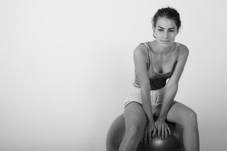 Black and white studio portrait of young Caucasian womanの写真素材